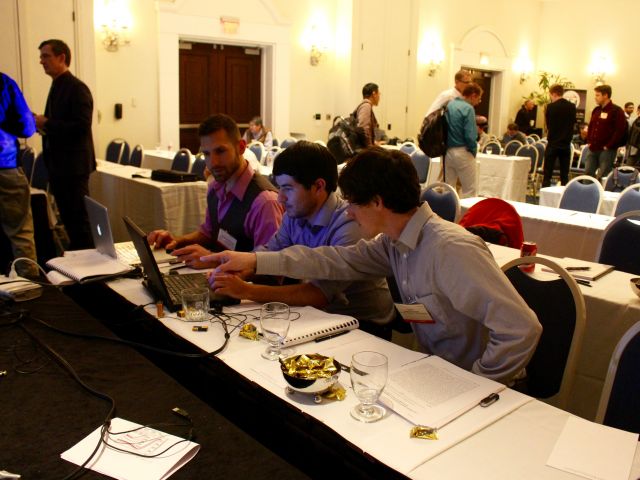 Tobias, Anthony, and Sean deliberating at PCSI 2016